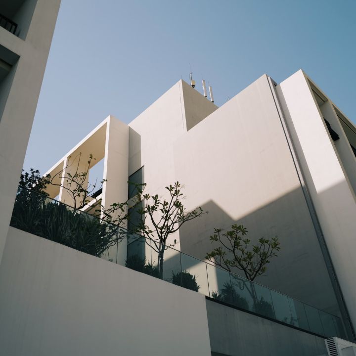 a white, flat-roofed, modern building