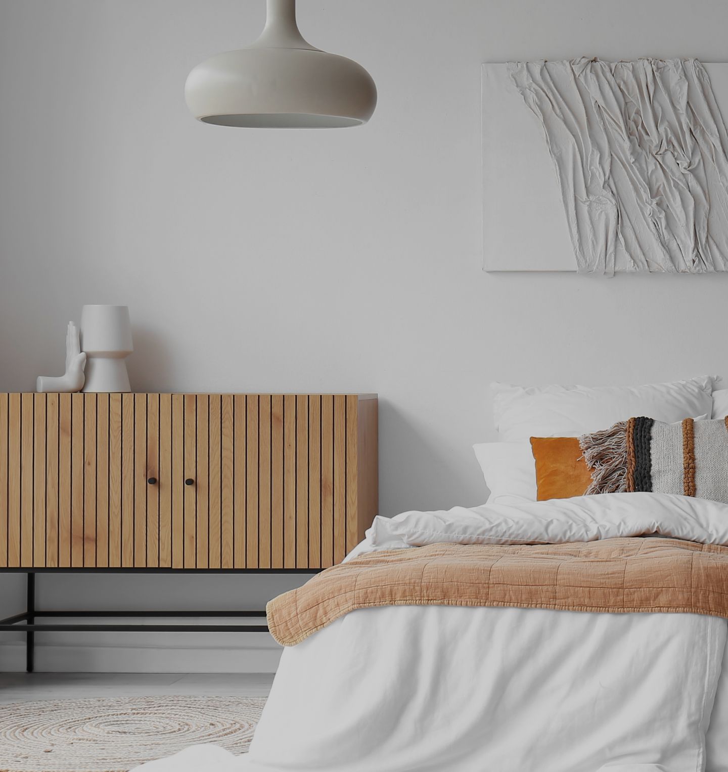 a bright bedroom decorated predominantly in white