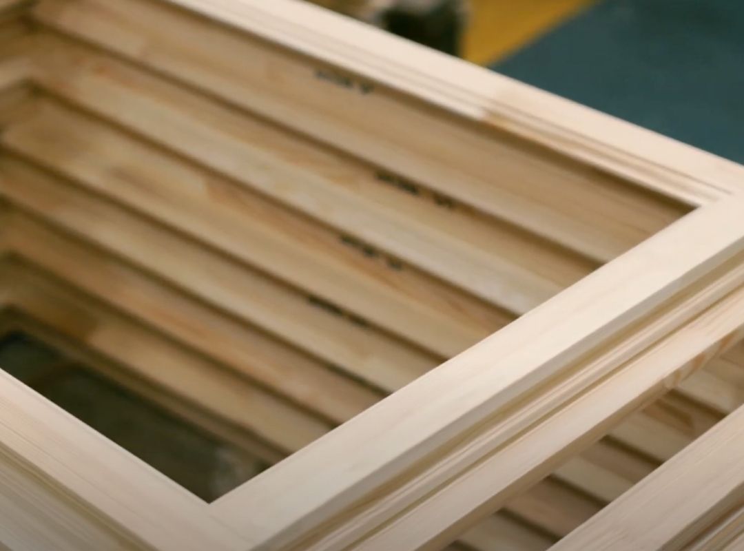 a pile of wooden frames